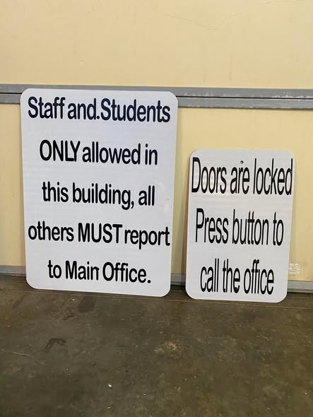 Professional storefront signage with custom lettering and company branding